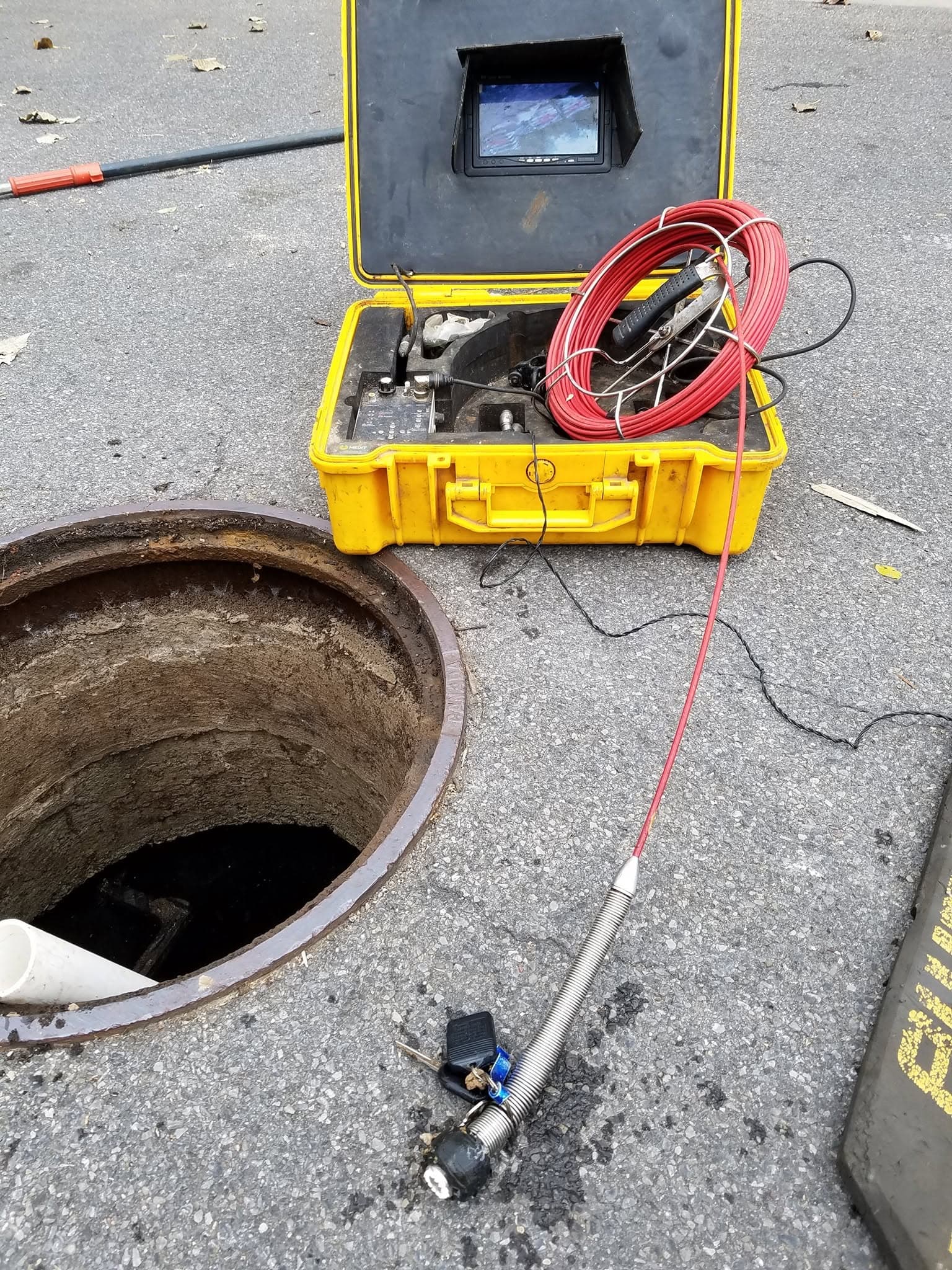 Inline sewer camera inspection at an open manhole