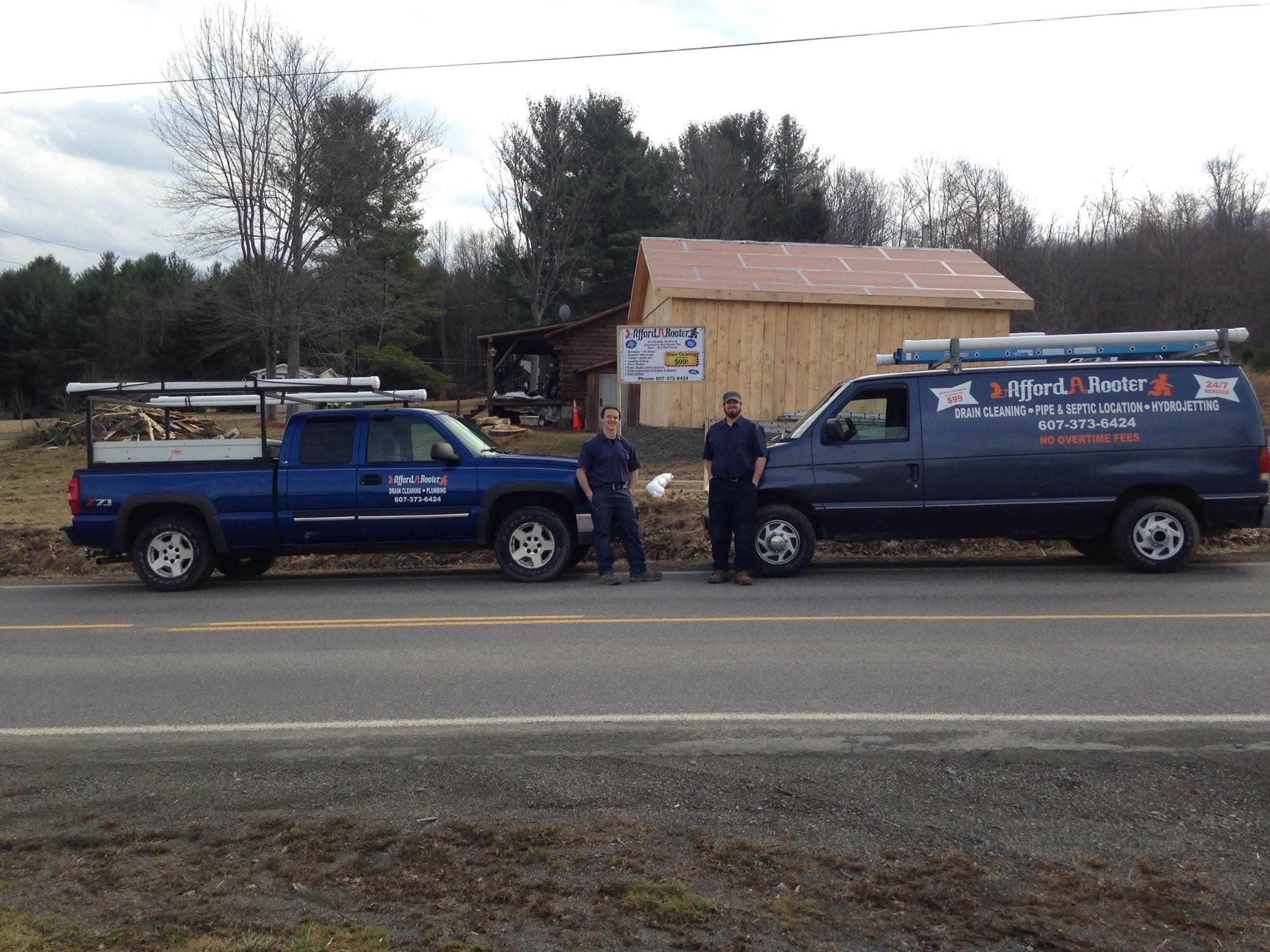 The Afford-A-Rooter team with the service truck and van